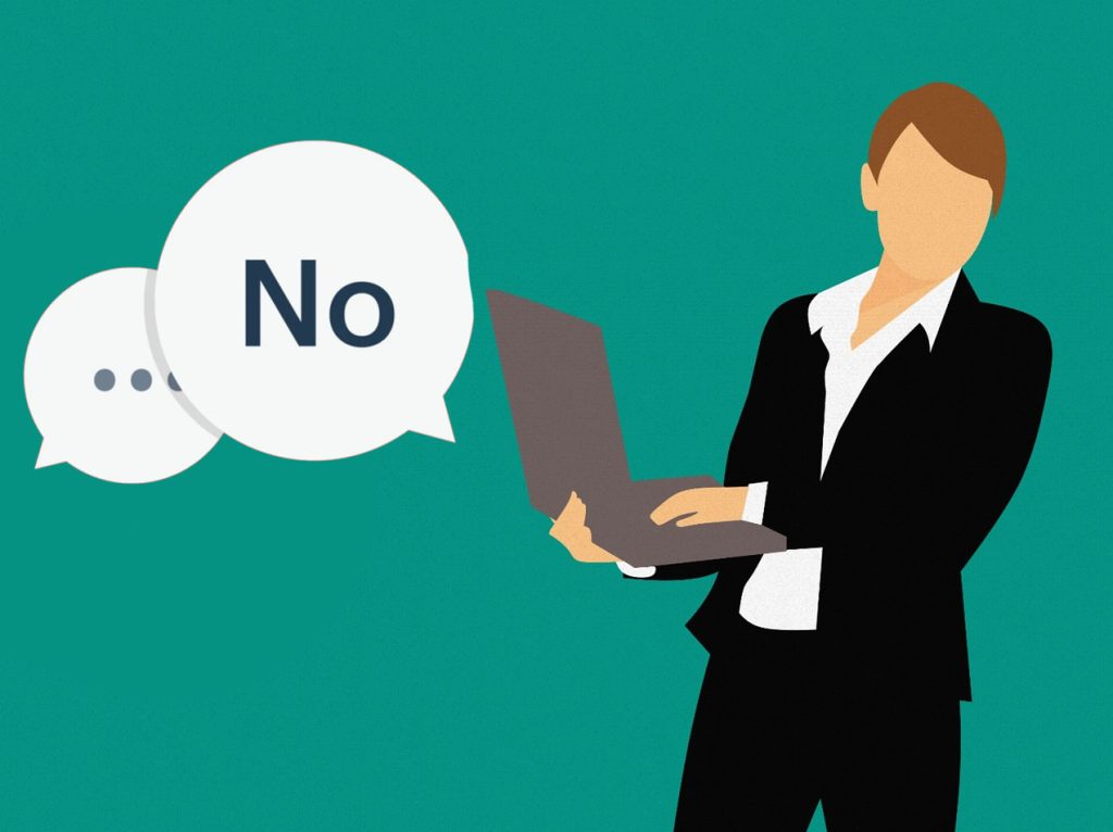 A person at work with a speech bubble saying "no"